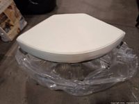 Top view of white triangular padded seat