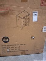 Box showing SEI Tory Mirrored Side Table illustration and specs