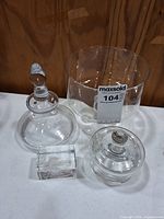 All four clear glass/crystal items grouped together