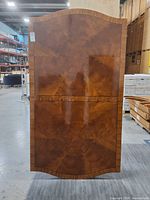 Full view of table top showing veneer pattern and shape