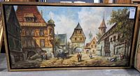 Front view of framed oil painting showing entire village street scene
