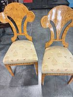 Front view of both burl veneer dining chairs