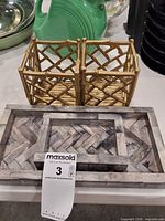 Two gold lattice holders and two bone⁄stone inlay trays