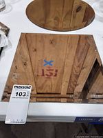 Square beveled edge mirror on table