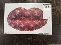 Front of print showing pink monogram lips, signatures