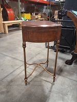 Full view of table showing wood top and metal legs