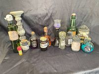 Group shot of all thirteen Halloween apothecary bottles and candle holders