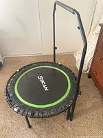 Full view of BCAN 36-inch rebounder trampoline with handlebar attached