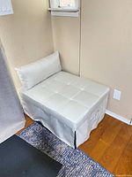 Ottoman folded with pillow on top