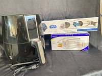 All three items: Farberware air fryer, Progressive potato cutter box, Williams-Sonoma Star Wars cookie cutter box