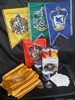 Full lot showing banners, runners, ribbon rolls, ornaments, inflatable box, envelope garland