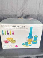 Front of Infinity Spiralizer box displaying product image, color options and 500-watt spec