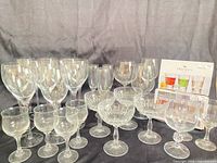 Group view of mixed stemware including wine glasses, coupes, cordials, balloon goblets, boxed shot glass set