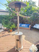 Full view of stainless steel patio heater on deck