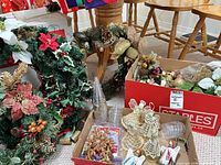 Assorted Christmas decorations including wreaths, ornaments, angels and garlands