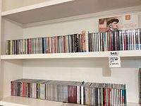 Two shelves holding large quantity of classical music CDs
