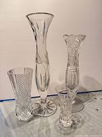 Group shot of the four crystal vases showing relative sizes and patterns