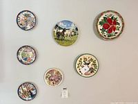 All seven plates displayed on wall