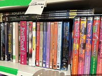 Shelf of assorted DVD cases including box sets and single volumes