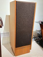 Front and side view of one Realistic Optimus T-100 speaker showing grille and cabinet