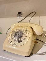 Front view showing rotary dial and handset