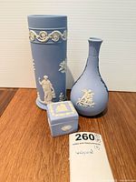 Group showing cylindrical vase, bud vase, trinket box
