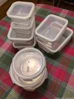 Stacked view of all nine glass containers with lids