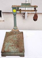 Full view of scale showing platform, column, beam, hanging weight