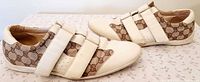 Pair of Gucci Tennis 1977 shoes side view showing GG canvas and Velcro straps