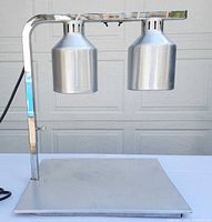 Full view of Bartrol dual-head heat lamp on stand
