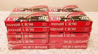 Front view of two 10-packs of sealed Maxell UR 90 cassettes stacked