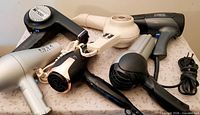 Group shot of six vintage hair dryers