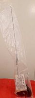 Full view of bagged 26-inch whip antenna