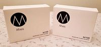 Front view of two sealed Mies BT100 receiver boxes