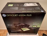 Front view of sealed HP OfficeJet 6500A Plus printer box
