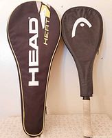 Two protective covers, black with HEAD branding
