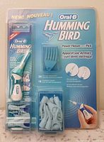 Front view of sealed Oral-B Hummingbird blister pack