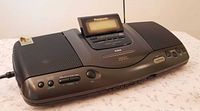 Front angled view showing stereo system with pop-up display and speaker grilles
