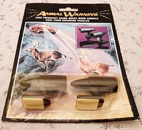 Front view of sealed blister pack showing whistles and graphics