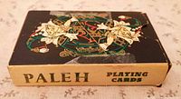 Front of Paleh playing card tuck box showing jester artwork and title
