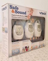Front of retail box showing three monitoring units and branding