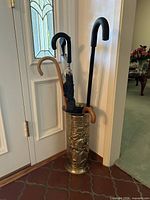 Full view of umbrella stand with contents