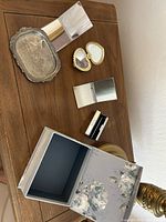 Group shot of all vanity items and boxes on table