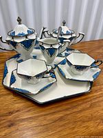 Group view of full 7-piece porcelain tea set