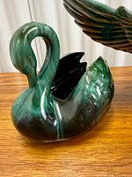 Swan planter side view showing glaze and open cavity