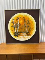 front view of framed circular painting