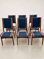 Front view of all six rosewood dining chairs