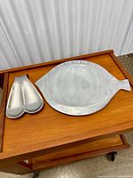Overhead view of both aluminum pieces on tabletop