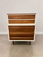 Front view of tallboy showing full elevation, drawer configuration and leg style