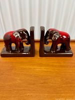 Pair of ceramic elephant bookends front view